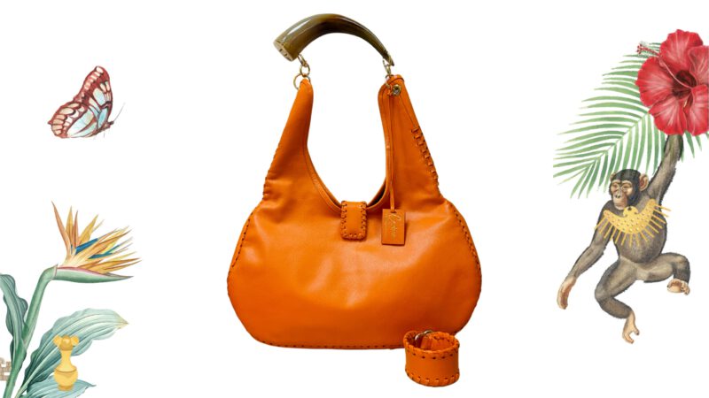 Bolso artesanal en piel de vaca naranja con cuerno